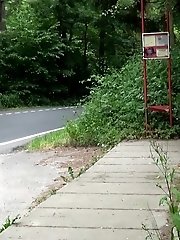 15 pictures - Pretty brunette pees next to a bus stop