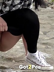 15 pictures - Exotic babe squats to piss near main road