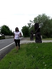15 pictures - Dark haired babe has a very long piss outside