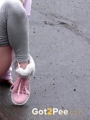 15 pictures - Blonde babe Claudia pisses down a drain outside