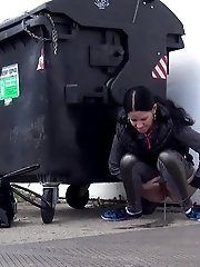 15 pictures - Dark haired girl is desperate to pee when walking