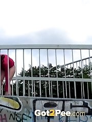 15 pictures - Brunette pulls down trousers to pee in public
