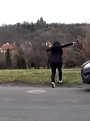 15 pictures - Chubby brunette pisses in the middle of the city