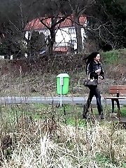 15 pictures - Black haired teen pisses on a wooden bench