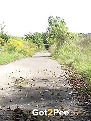 15 pictures - Sexy blonde squatting to pee outside on a road