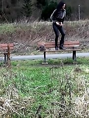 15 pictures - Black haired teen pisses on a wooden bench