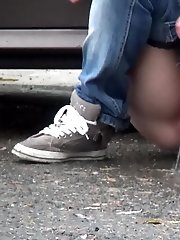 15 pictures - Two friends piss behind a parked car