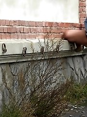 15 pictures - Sexy brunette lifts up her dress to piss