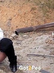 15 pictures - Cute blonde in glasses pisses over the ground