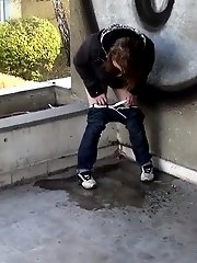 15 pictures - Cute girl in denims pisses onto the concrete