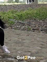 15 pictures - Exotic babe squats to piss near main road