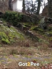 15 pictures - Cute girl in plaid skirt and blazer pisses outside