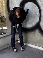 15 pictures - Cute girl in denims pisses onto the concrete