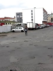 15 pictures - Busty brunette pees behind a bus