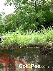 15 pictures - Cute blonde squatting to pee outside in public