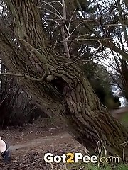 15 pictures - Stunning redhead stands to piss outside