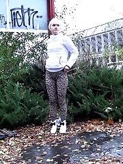 15 pictures - Pretty blonde teen pees in public near buildings