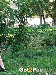 15 pictures - Sexy dark haired girl pisses while outside