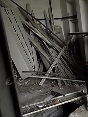 15 pictures - Dark haired girl pisses in an abandoned building