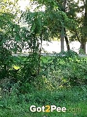 15 pictures - Sexy dark haired girl pisses while outside