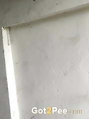 15 pictures - Dark haired girl pisses in an abandoned building