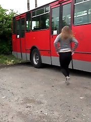 15 pictures - Busty brunette pees behind a bus