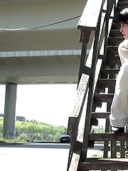15 pictures - Pretty dark haired girl sprays her piss onto steps
