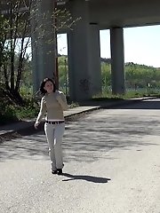 15 pictures - Pretty dark haired girl sprays her piss onto steps