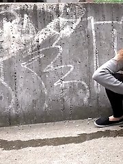 15 pictures - Hot brunette pisses in the middle of the city