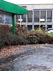 15 pictures - Pretty blonde teen pees in public near buildings