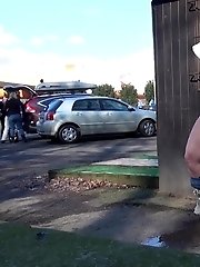 15 pictures - Pretty brunette pisses in public by the airport