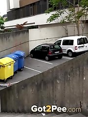 15 pictures - Hot brunette pisses in the middle of the city