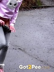 15 pictures - Blonde babe Claudia pisses down a drain outside