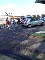 15 pictures - Pretty brunette pisses in public by the airport