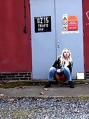 15 pictures - Pretty blonde squats on concrete to piss