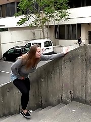 15 pictures - Hot brunette pisses in the middle of the city