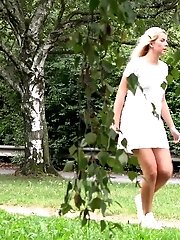 15 pictures - Pretty blonde pisses outside on a bench