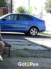 15 pictures - Gorgeous big boobed blonde pisses in public