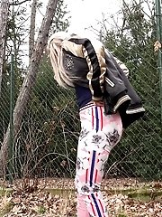 15 pictures - Funky looking blonde squats to piss while outside