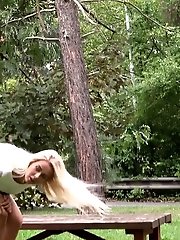15 pictures - Pretty blonde pisses outside on a bench
