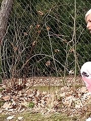 15 pictures - Funky looking blonde squats to piss while outside