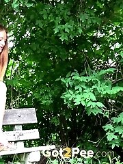 15 pictures - Stunning brunette cant stop peeing on a bench