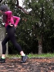 15 pictures - Dark haired girl squats to piss on a road