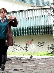 15 pictures - Cute girl in boots pisses outside in the city