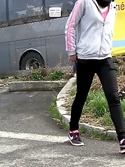 15 pictures - Dark haired girl pisses by a public car park