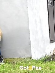 15 pictures - Cute blonde pisses next to a busy road