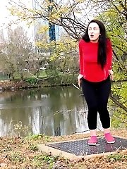 15 pictures - Dark haired European pisses outside by river