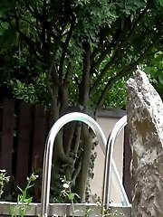 15 pictures - Redhead pisses in her neighbours swimming pool