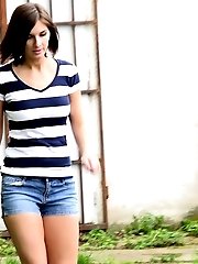 15 pictures - Hot brunette pissing over a path while outside