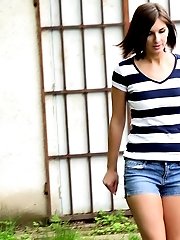 15 pictures - Hot brunette pissing over a path while outside